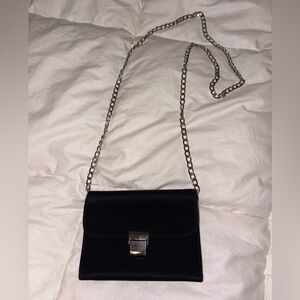 Black and silver wallet with silver Crossbody chain excellent condition